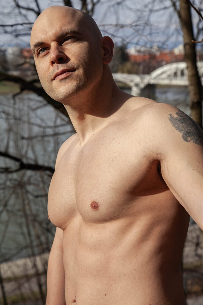 Portrait of Slovak man standing in the sun in the forest