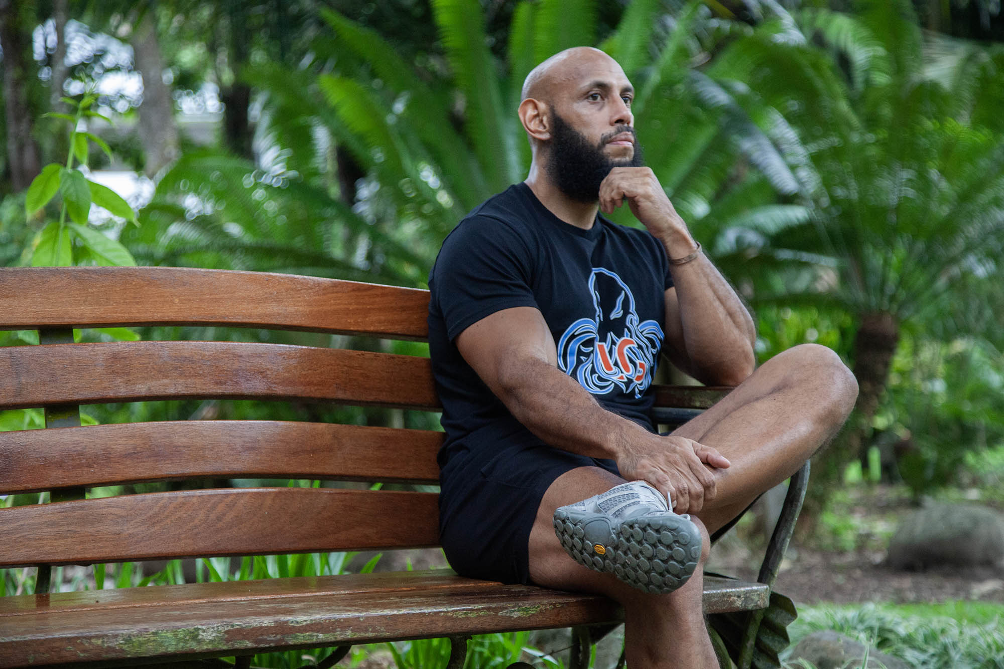 Mengui sitting on bench in Botanical Gardens, Cairns, Australia